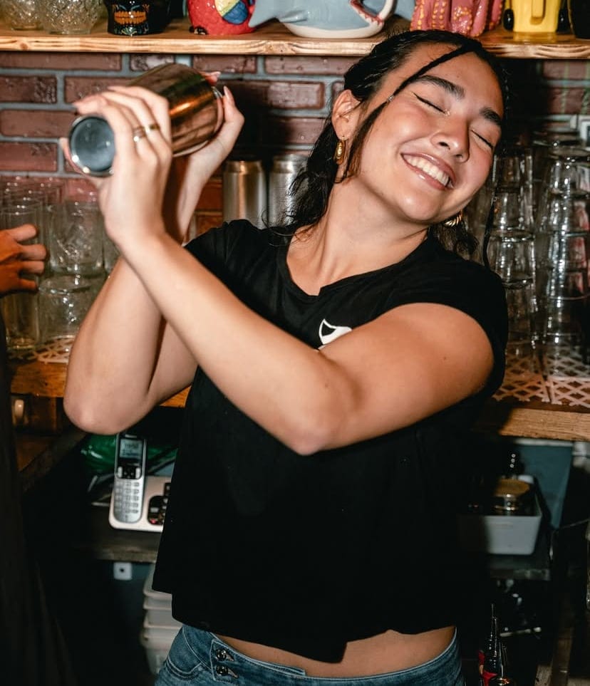 Sophie shaking a cocktail.